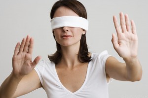 Blindfolded Woman with Arms Raised