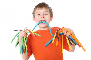 Boy holding colorful licorice candy