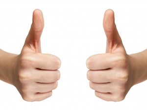 female teen hands shows thumbs up