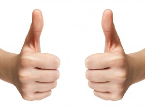 female teen hands shows thumbs up