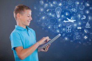 http://www.dreamstime.com/stock-photo-young-boy-using-tablet-school-learning-technology-concept-child-looking-computer-image45407930